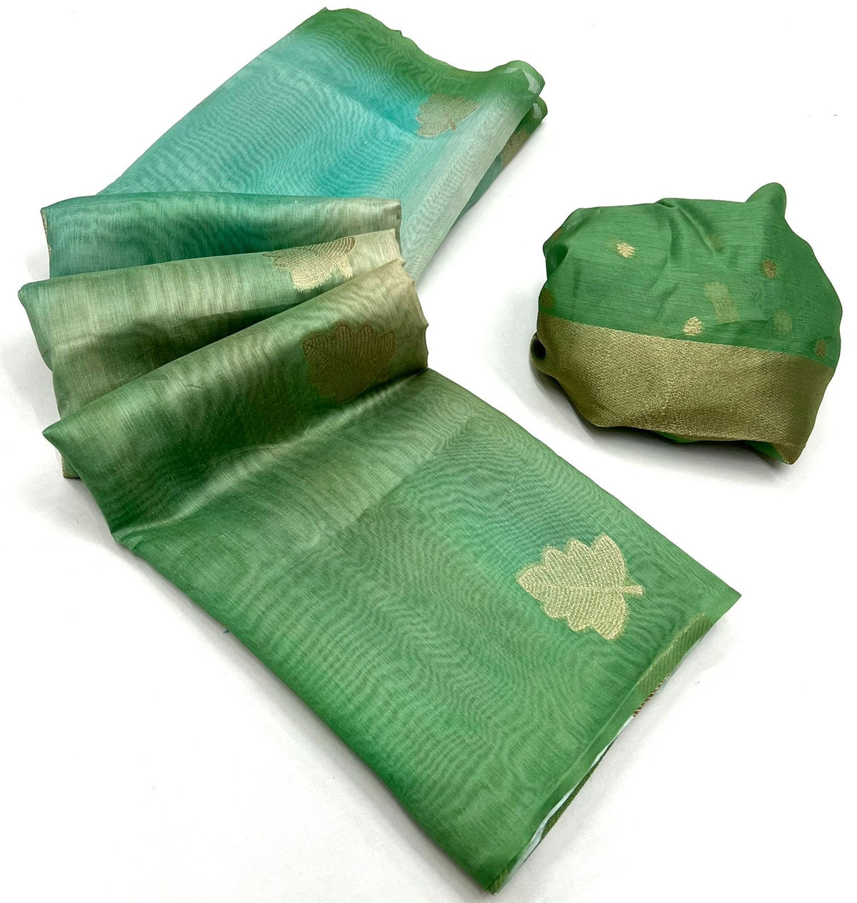 Green linen easy saree with gold star motif print, folded with matching pouch