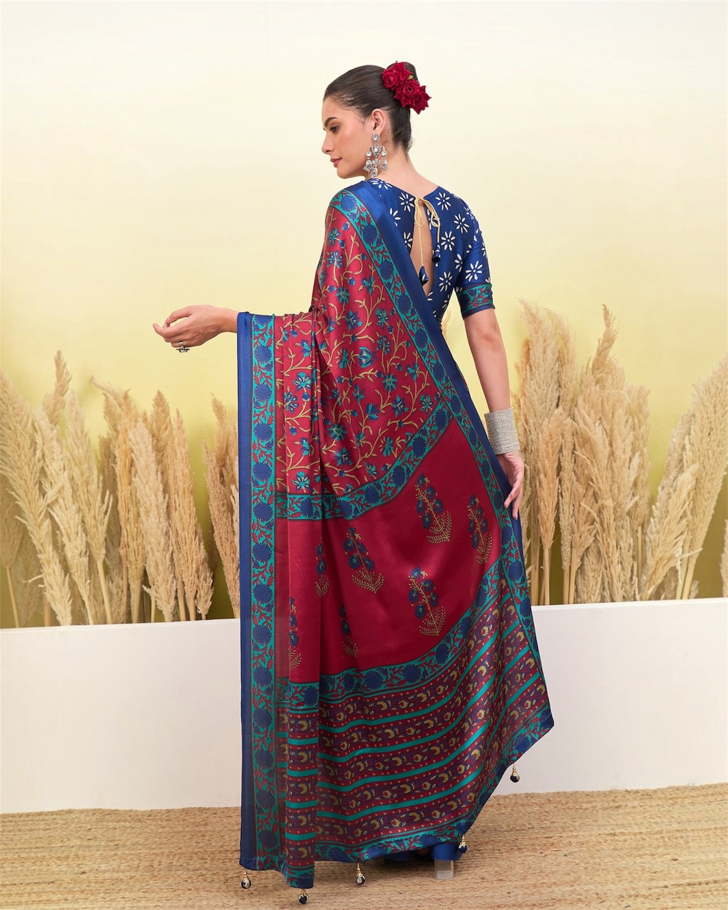 Back view of red and royal blue floral printed saree with long fall and border
