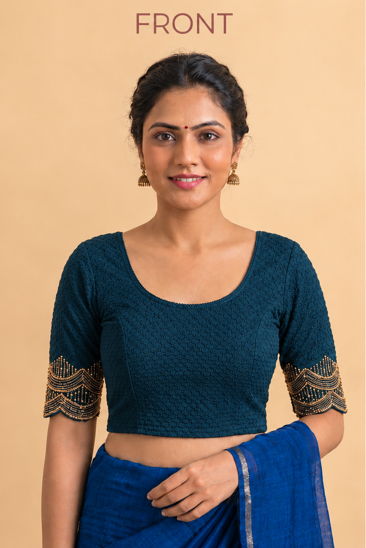Dark teal stretchable blouse with a scoop neck, textured fabric, and gold-trimmed sleeves