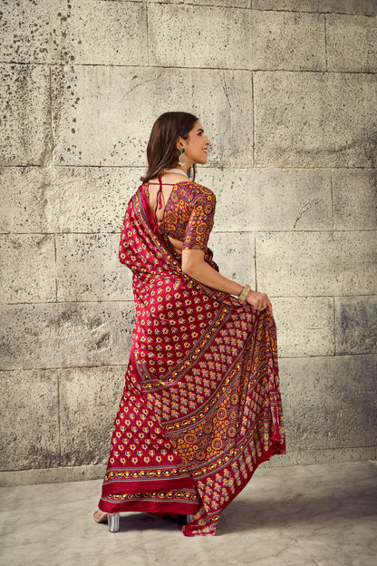 Red printed ready-to-wear saree with decorative border, side drape view