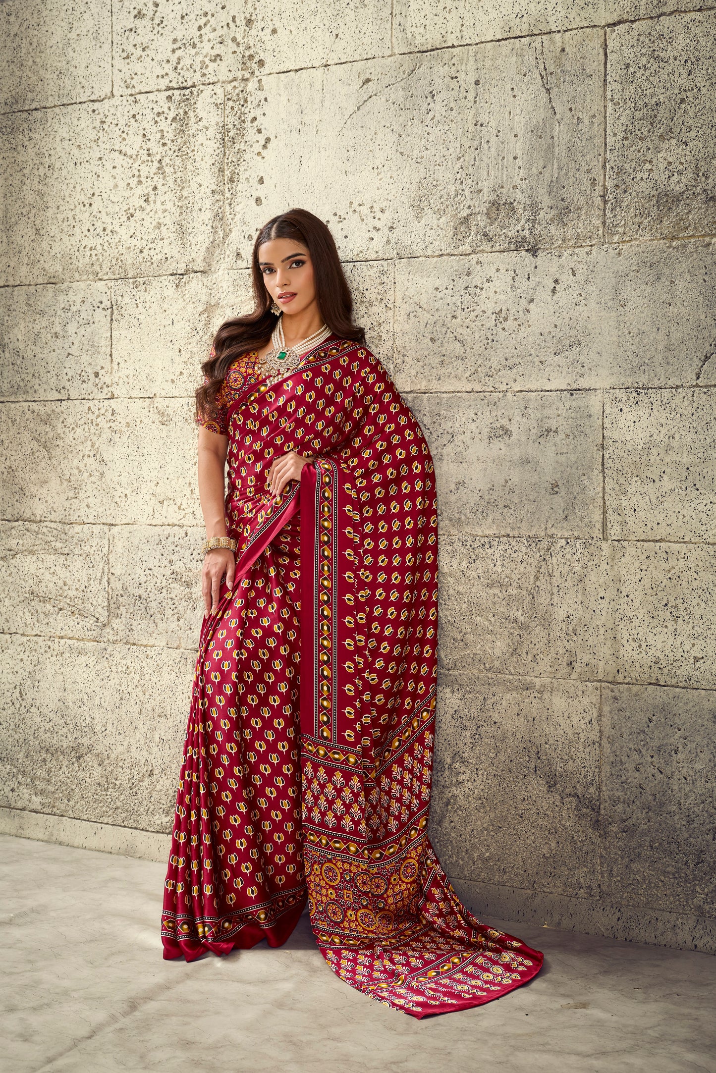 Red printed ready-to-wear saree with wide border and pallu, full-length view