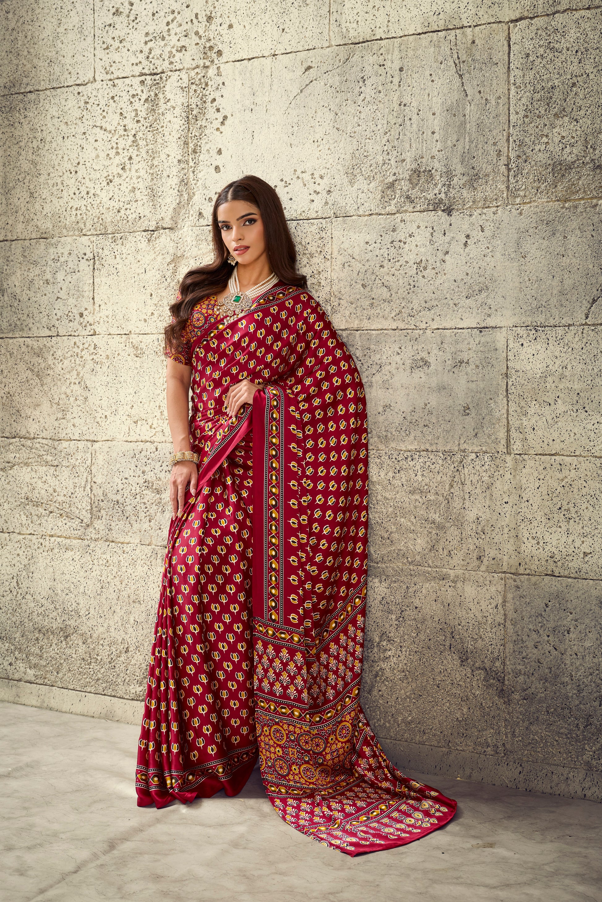 Red printed ready-to-wear saree with wide border and pallu, full-length view