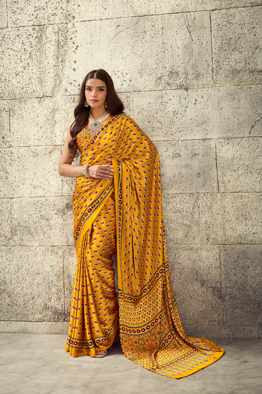 Mustard yellow patterned saree with contrast border, draped pallu and matching blouse