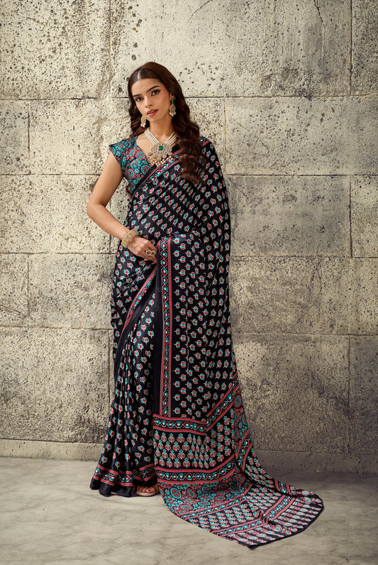 Dark printed ready-to-wear saree with sleeveless blouse, ornate turquoise border and hem