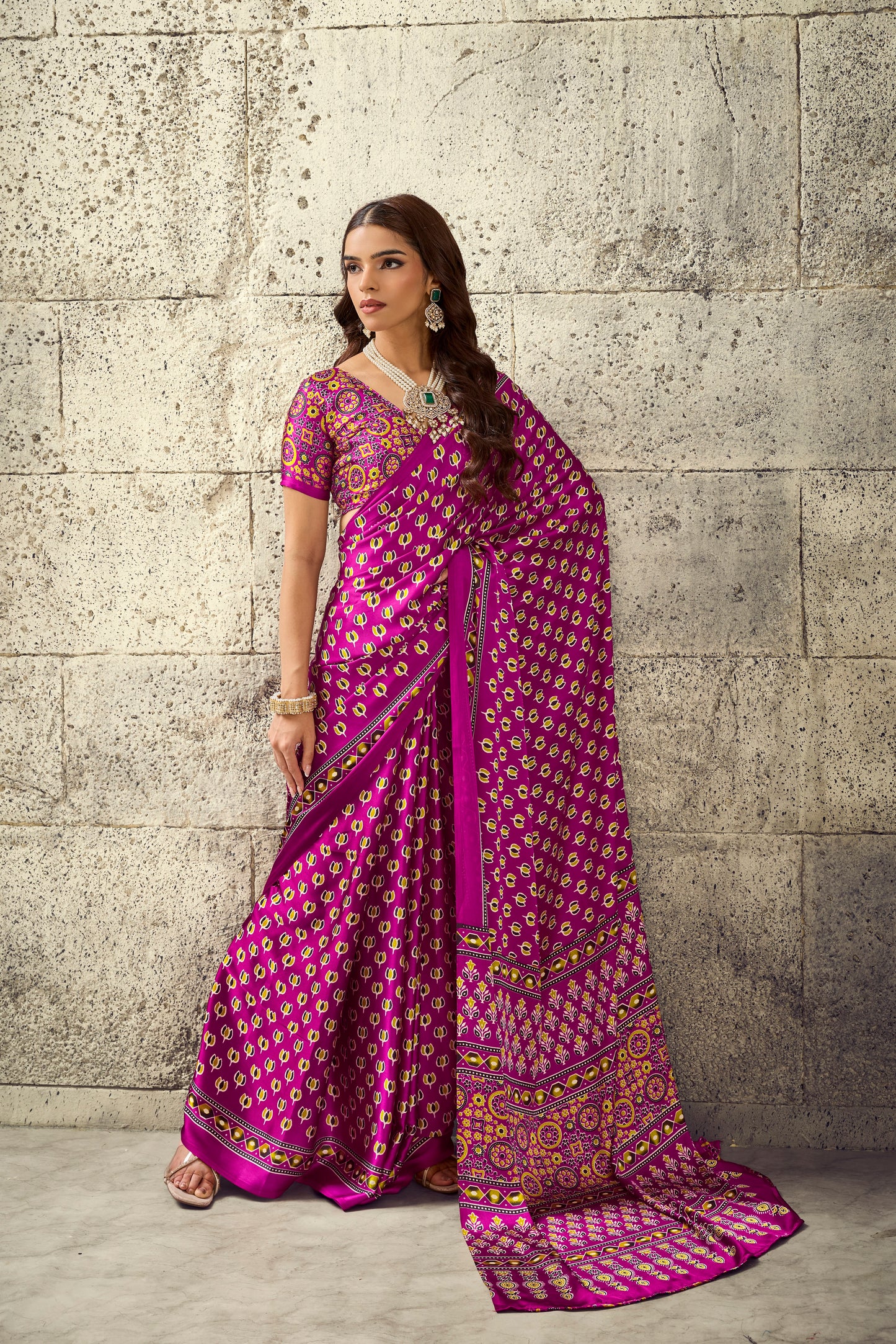 Magenta ready-to-wear saree with ornate border, short sleeves, and patterned pallu drape