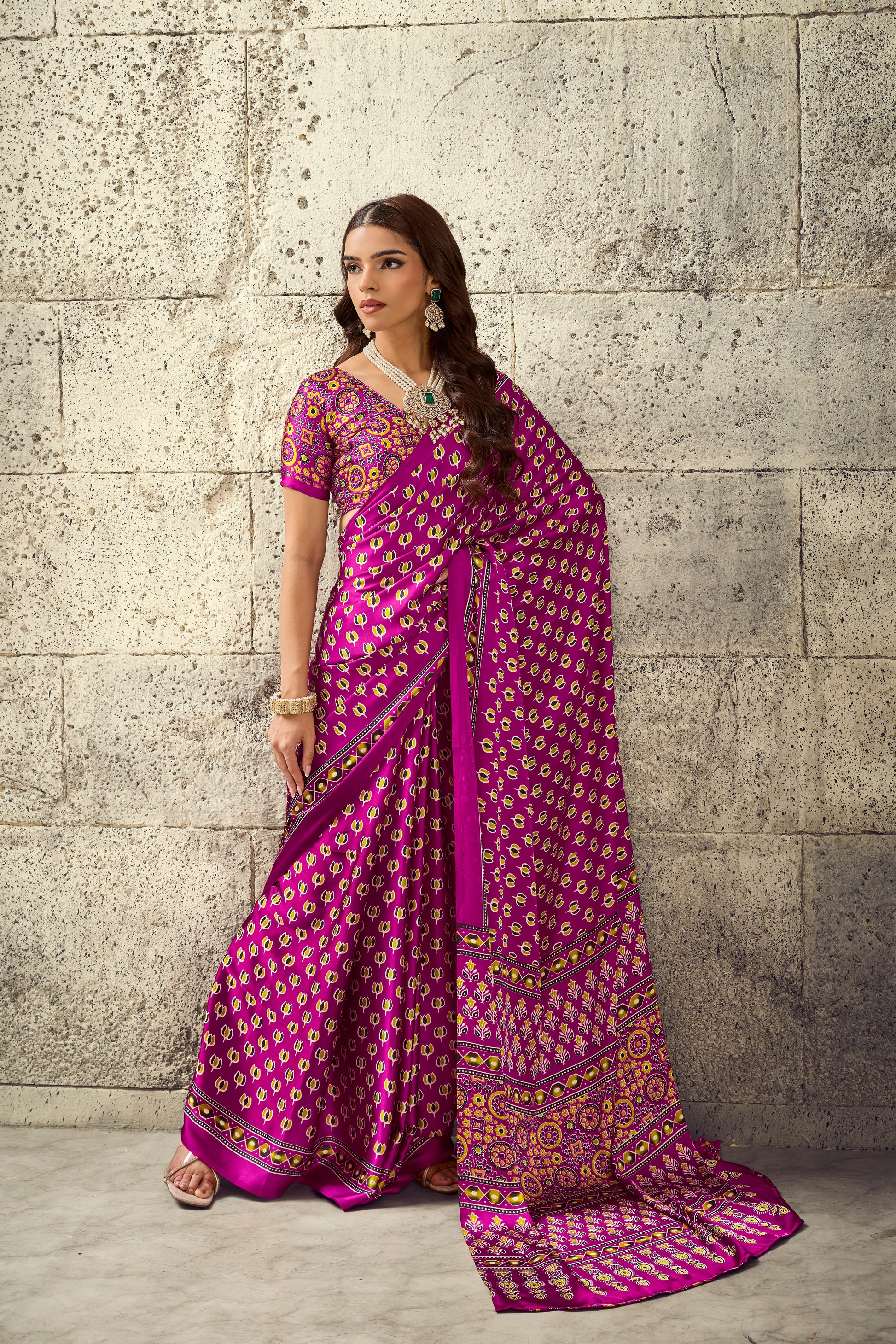 Magenta ready-to-wear saree with ornate border, short sleeves, and patterned pallu drape