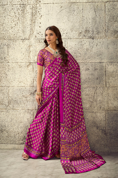 Magenta ready-to-wear saree with ornate border, short sleeves, and patterned pallu drape