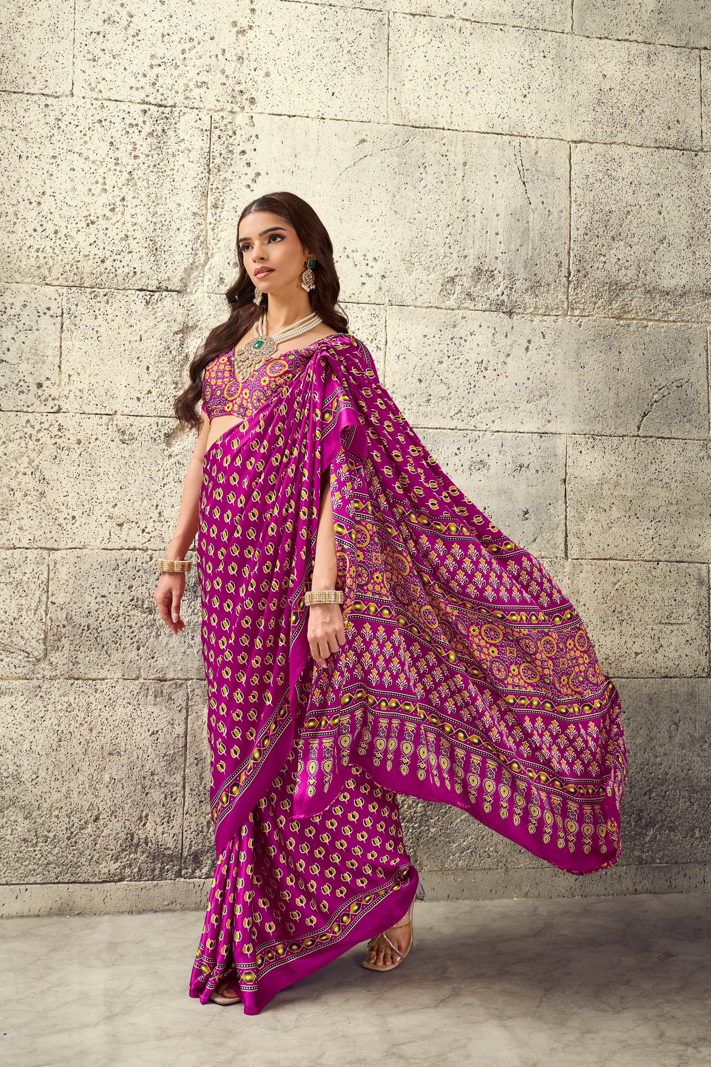 Magenta allover motif saree with wide border and flowing pallu, ready-to-wear style