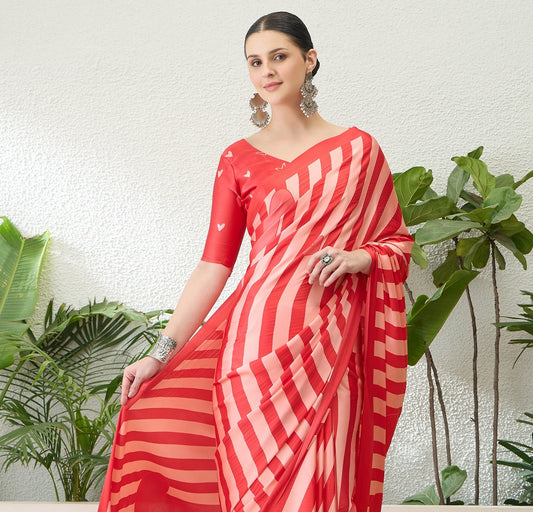 Red and pink striped saree with heart motifs, draped with elbow-sleeve V-neck blouse