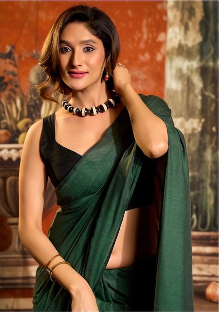 Green cotton easy saree with black contrast pallu, diagonal wrap, and necklace neckline