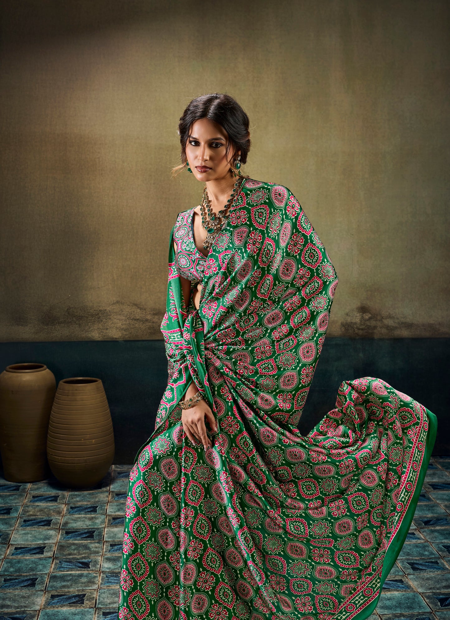 Green modal silk easy saree pallu spread, ornate pink motifs and red-green trim