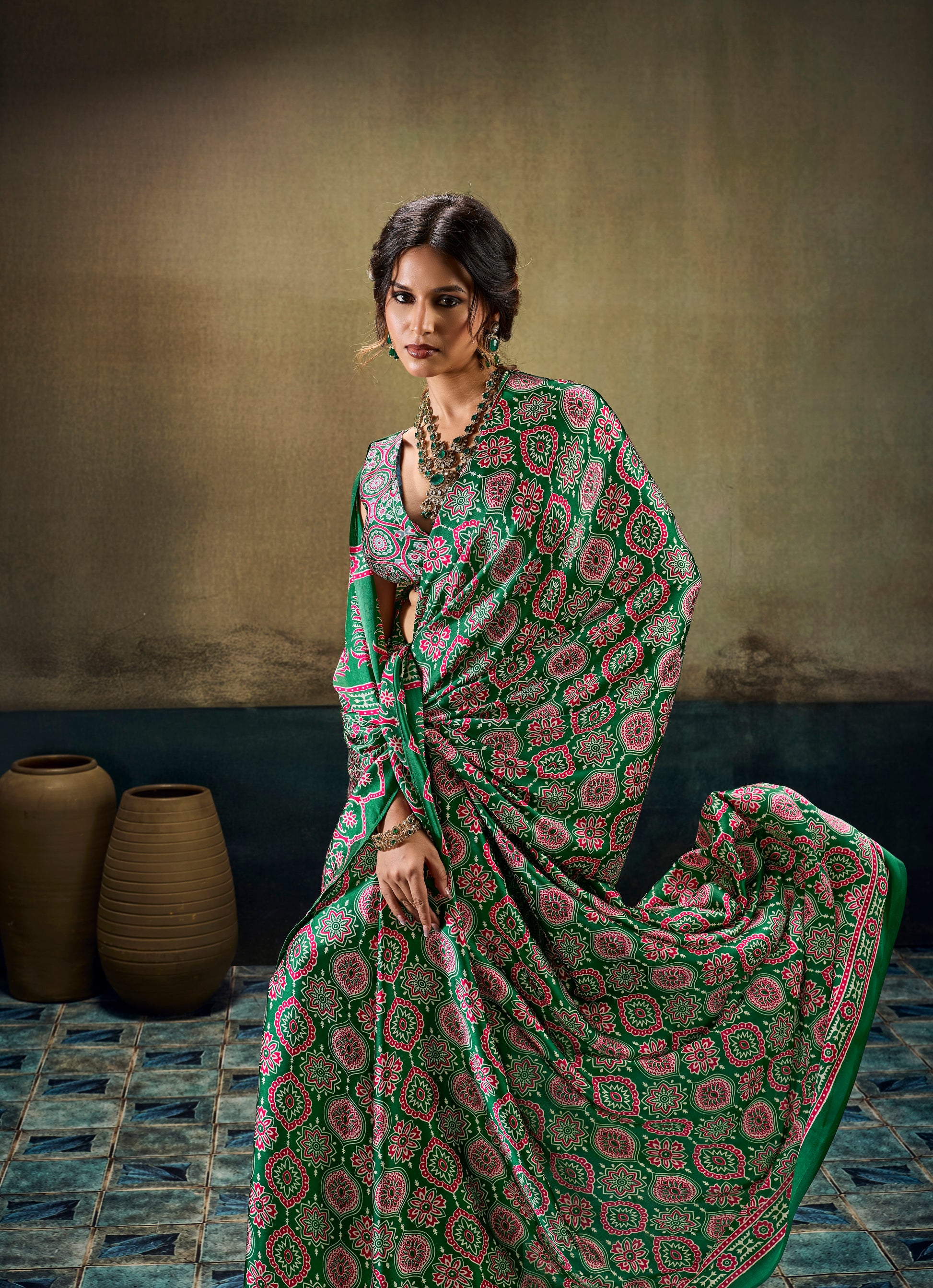 Green modal silk easy saree pallu spread, ornate pink motifs and red-green trim