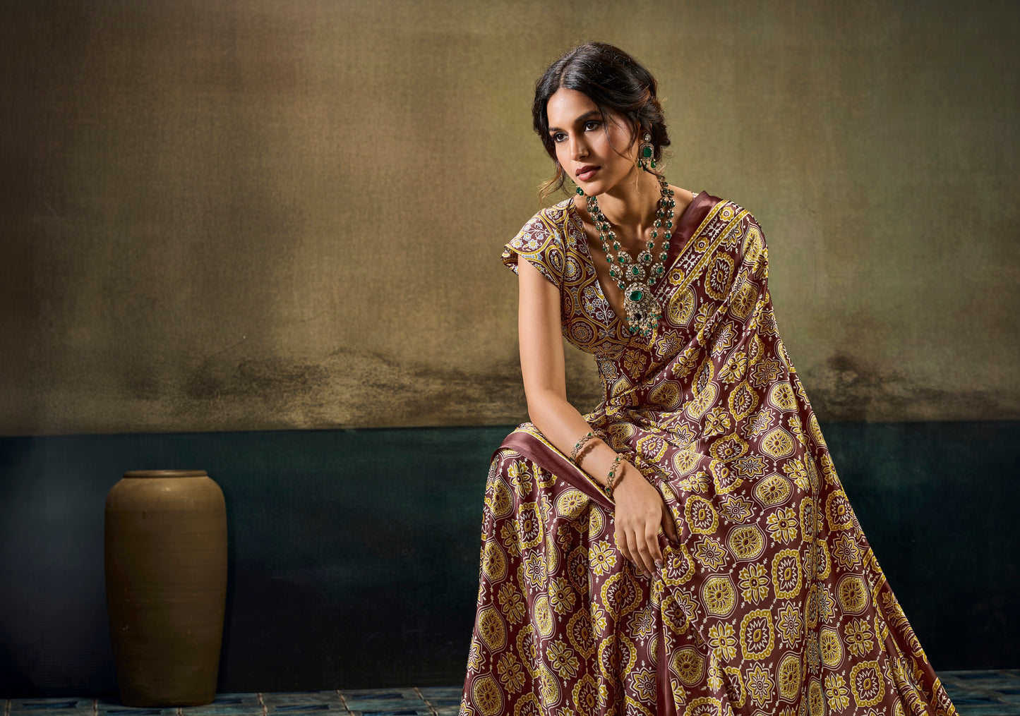 Brown patterned ready-to-wear saree with short sleeves and ornate border drape