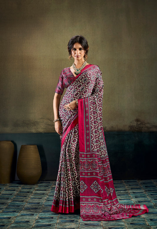 Ready-to-wear saree with ornate motifs and deep pink border, draped pallu, full length.