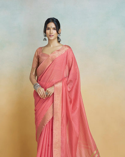 Coral pink khadi silk saree with gold border, draped pallu and blouse, close view
