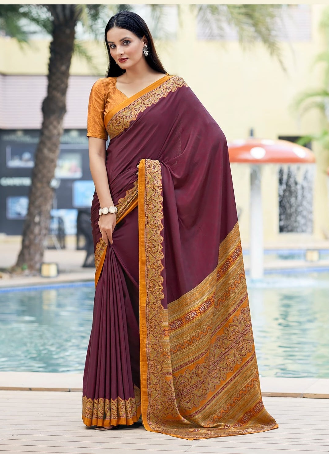 Plum crepe silk easy saree with ornate gold border and draped pleats, short sleeve blouse