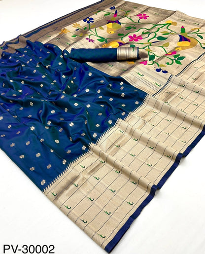 Laid-out blue and beige silk saree with gold motifs and colorful floral vine border
