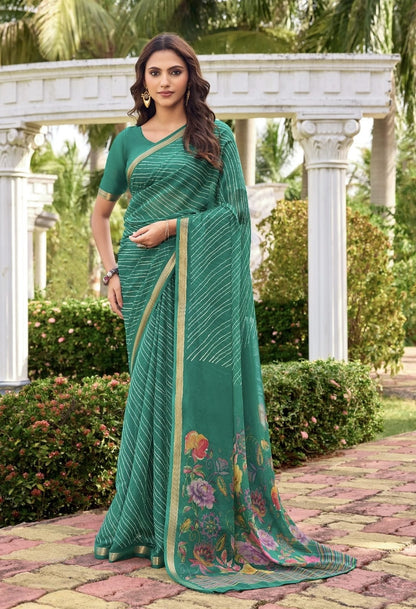 Sea green georgette saree with gold border and floral pallu, draped with blouse sleeves