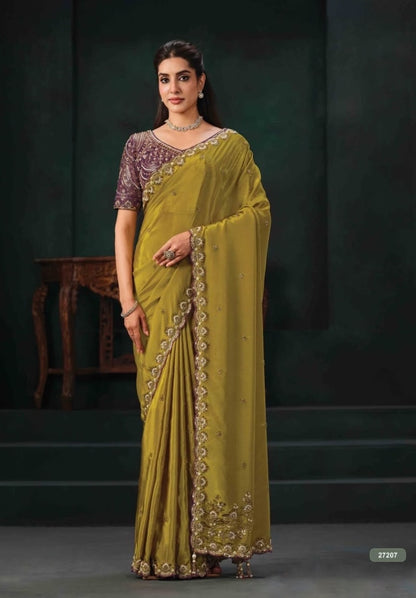 Olive green ready-to-wear saree with a purple embroidered blouse and embellished border