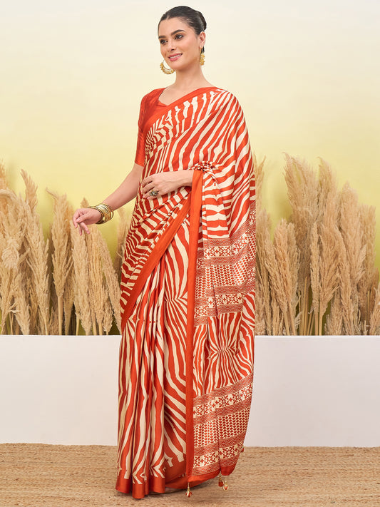 Orange striped crepe silk saree with gold border, pleated drape and pallu