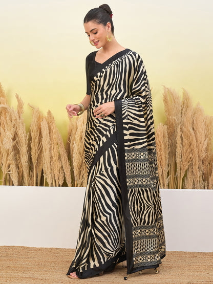 Black crepe silk easy saree with flowing zebra stripes and ornate border section