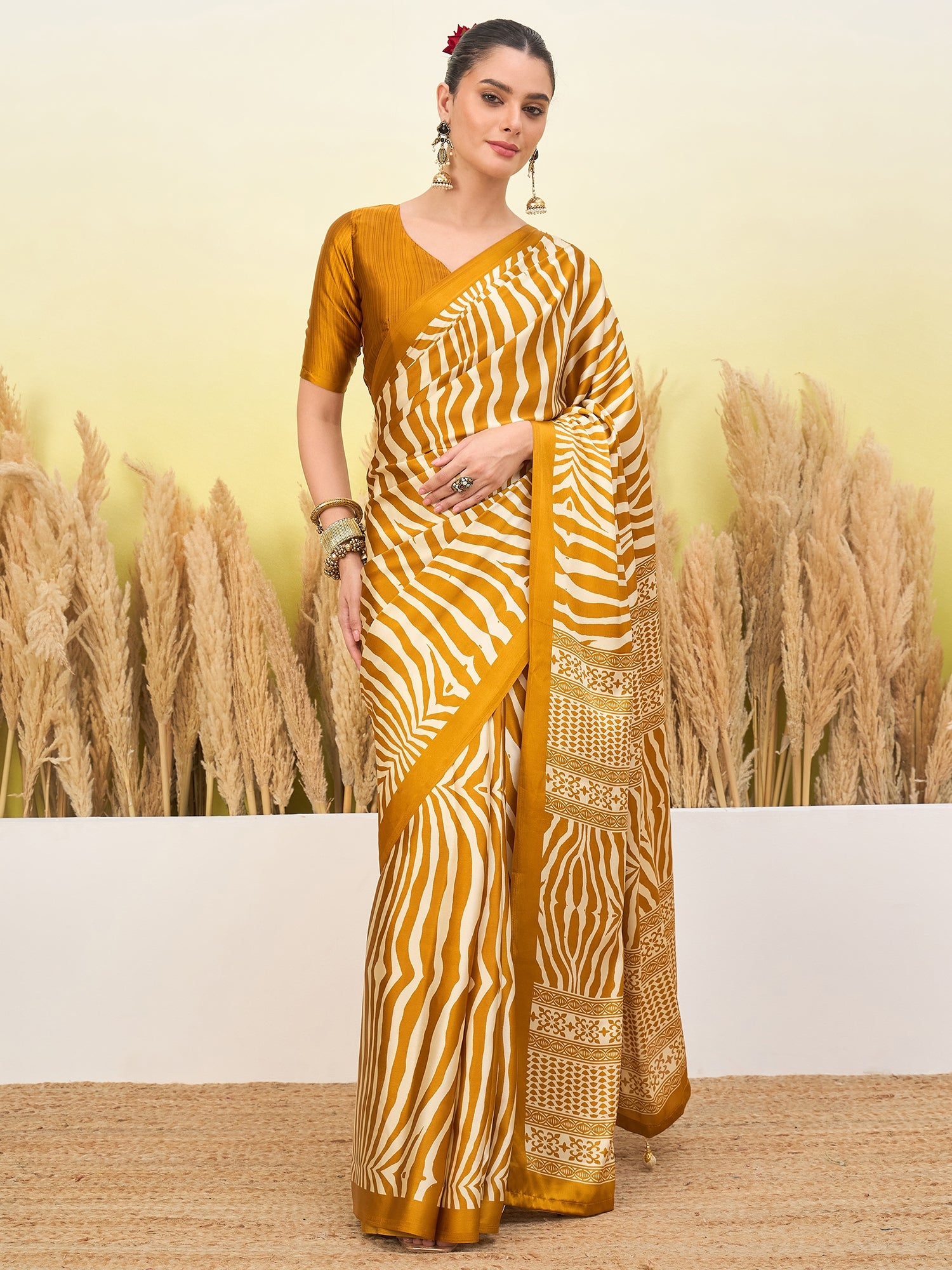 Mustard yellow easy saree with diagonal zebra stripes and gold patterned pallu border