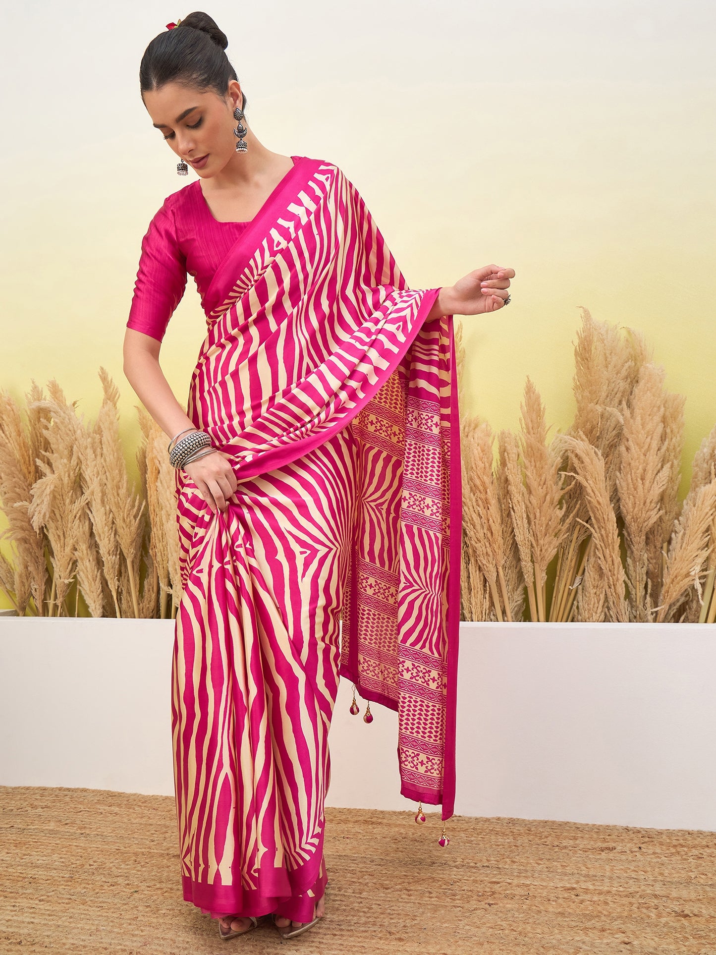 Pink crepe silk easy saree, zebra stripe drape with tasseled border detail