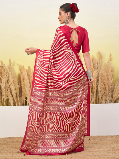 Red sari draped over shoulder with white zigzag stripes and gold hem, open-back blouse