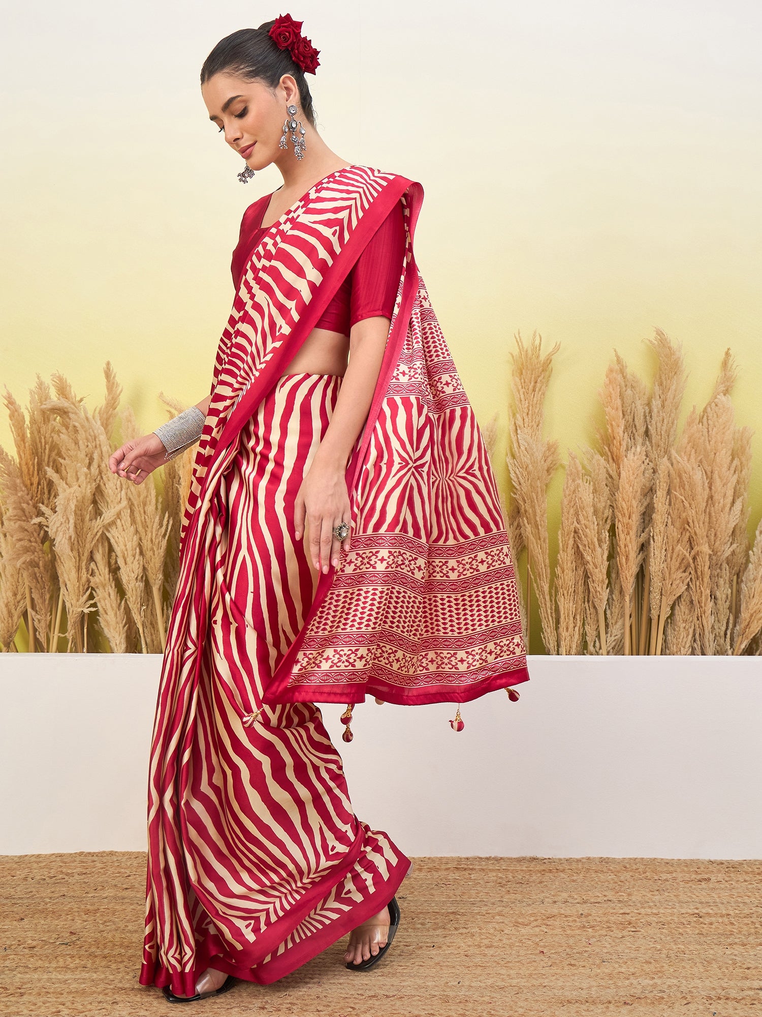 Red and white zigzag sari with gold border and tasseled hem, with 3/4 sleeve blouse