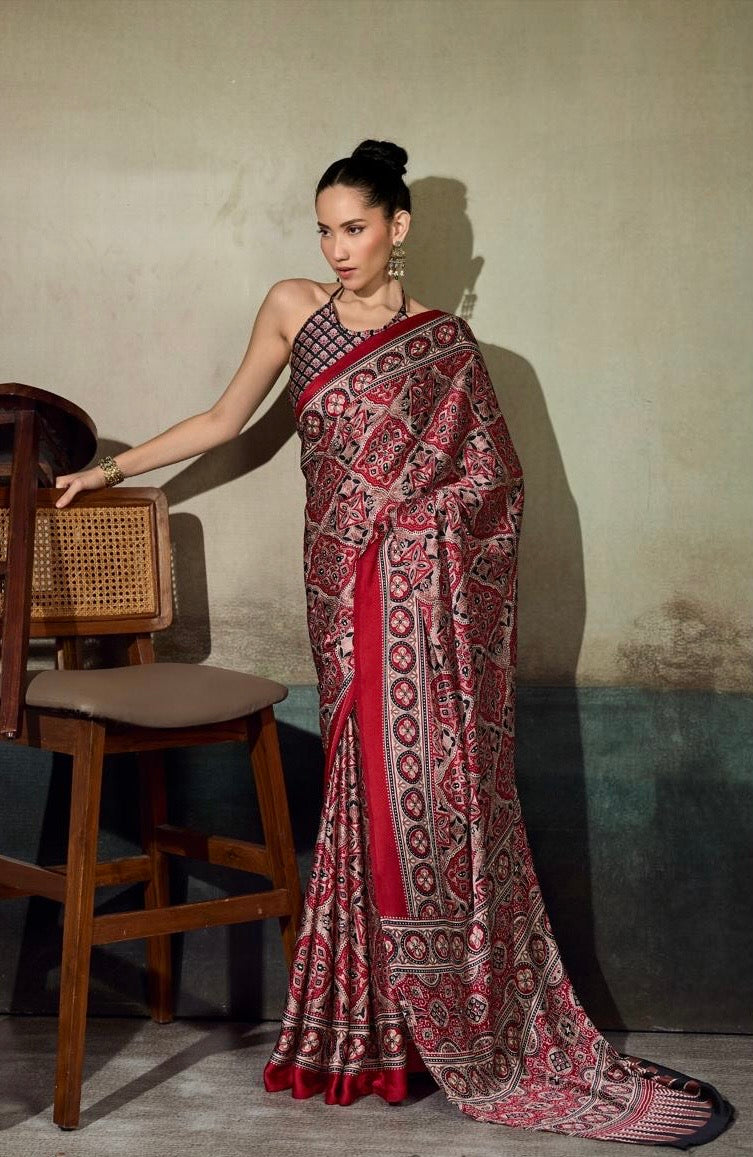 Red patterned saree with bold border, ready-to-wear drape, full-length
