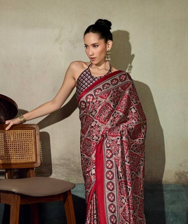 Red patterned saree with bold border, ready-to-wear drape, side view