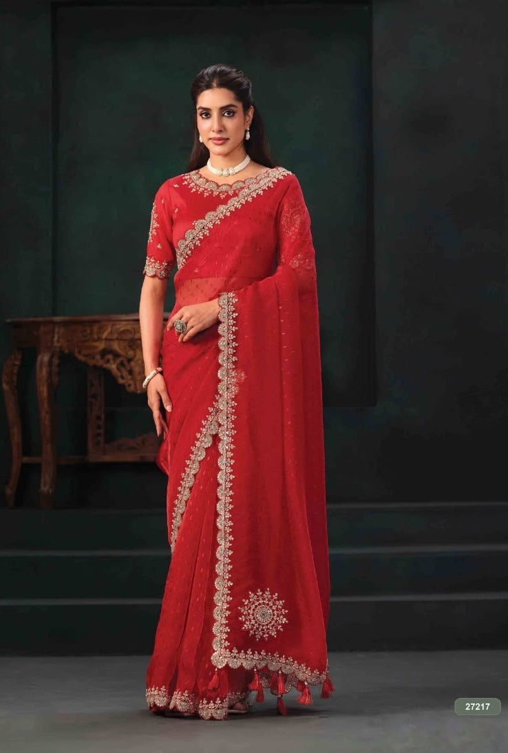 Cherry red saree with a pre-stitched embroidered blouse and ornate gold-tone borders