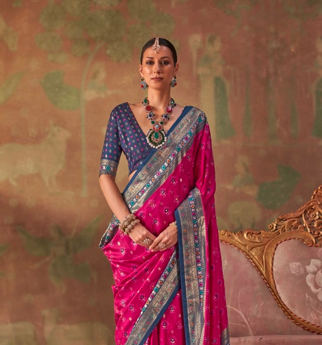 Pink and blue silk saree with patterned pallu border, elbow-length sleeves blouse