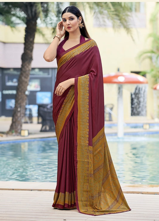 Wine crepe silk ready-to-wear saree in maroon with gold woven border, draped on model