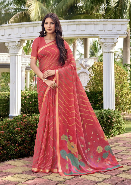 Coral pink georgette saree with gold-line pattern and floral motifs, draped full length
