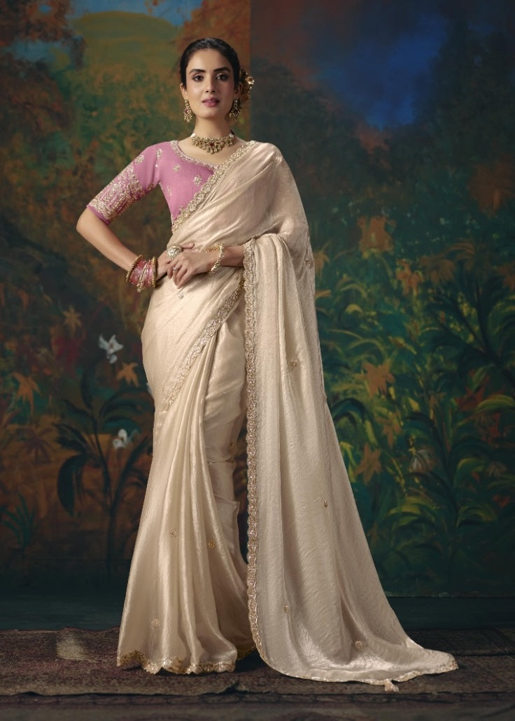 Off-white tissue silk ready-to-wear saree with ornate border, shown full length