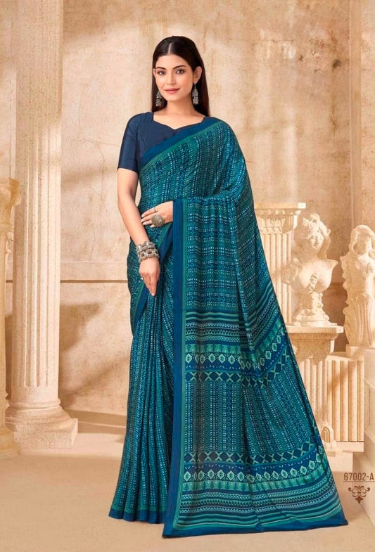 Deep blue-green saree with contrast border and matching short-sleeve blouse, draped