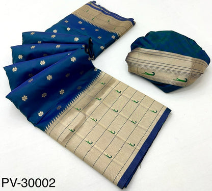 Folded blue and beige silk saree fabric with gold motifs and woven striped border