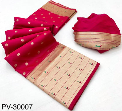 Folded red and beige Paithani silk saree with gold border and scattered floral motifs