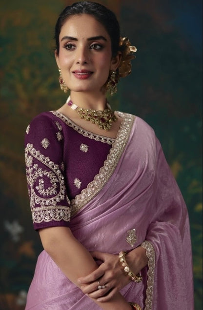 Rose pink tissue silk ready-to-wear saree with ornate border, paired with a purple embroidered blouse