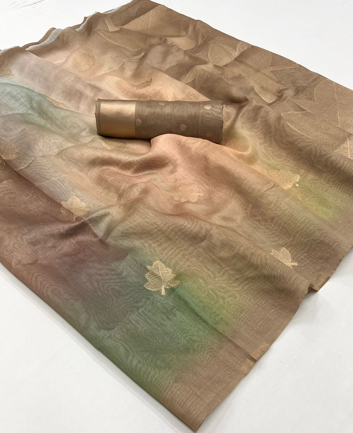 Champagne gold printed linen ready-to-wear saree with leaf motifs, folded view