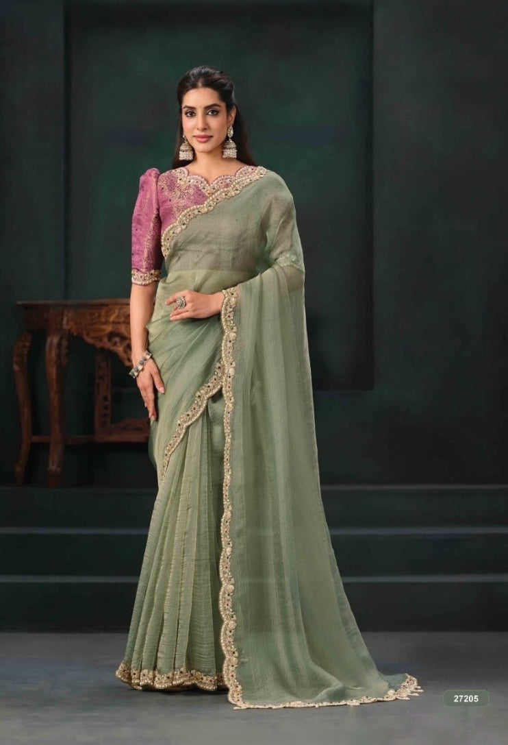 Pista green ready-to-wear saree with gold trim and a pre-stitched pink blouse