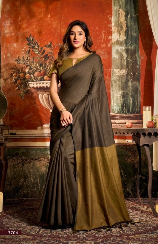 Dark taupe cotton easy saree with gold border, draped full-length.