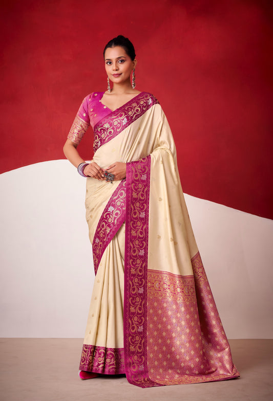 Ivory satin silk saree with magenta border and patterned pallu, paired with pink blouse