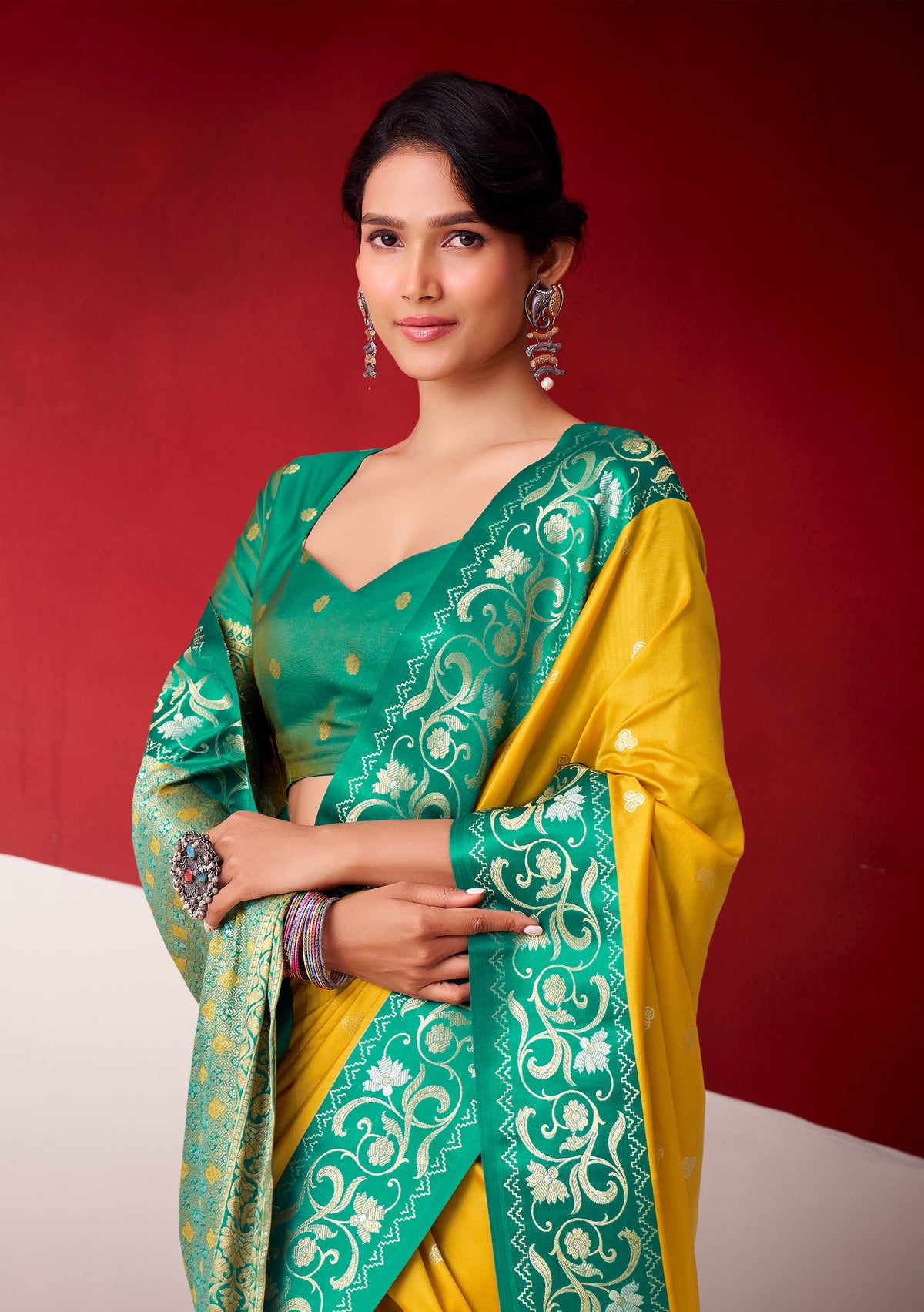 Yellow satin silk easy saree with teal-green panel and ornate print detail, ready to wear