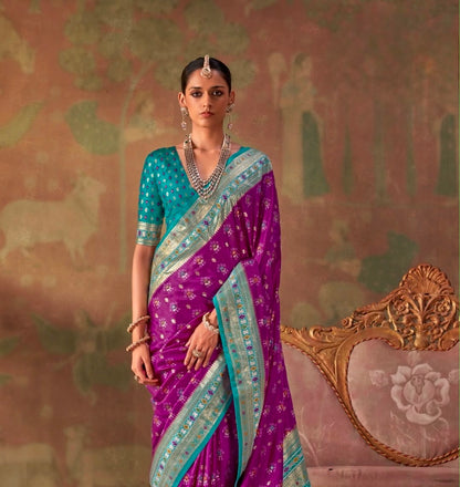 Purple silk easy saree with teal border and patterned pallu, worn with teal blouse