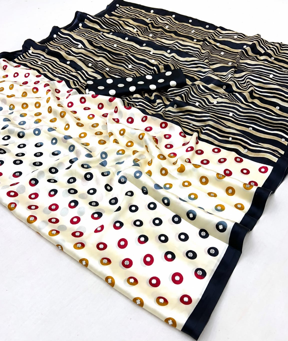Ready-to-wear polka dot mirror crepe silk saree with striped border, folded view
