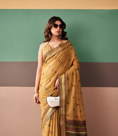 Mustard cotton easy saree draped with striped border and scattered print motifs