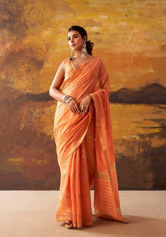 Orange cotton ready-to-wear saree with gold border, draped over one shoulder