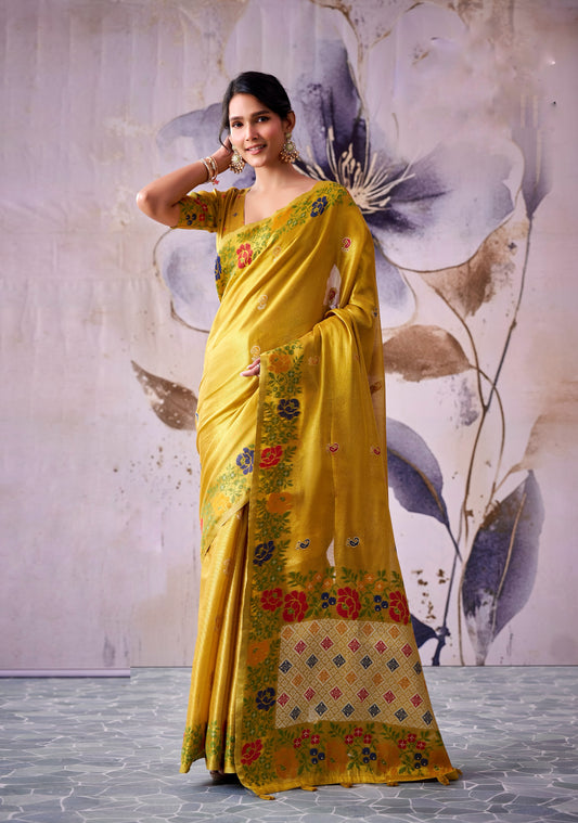Mustard gold tissue silk saree with multicolor floral border and elbow-sleeve blouse